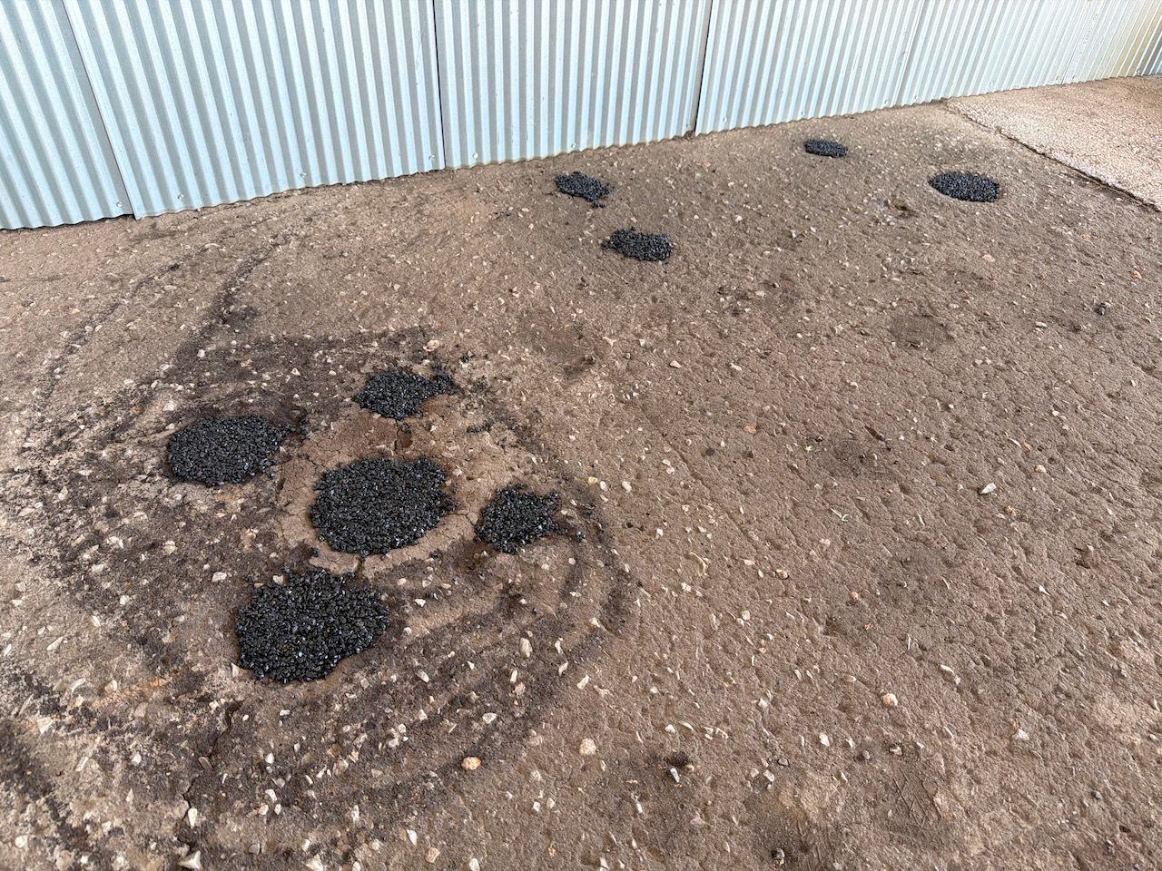 filling holes with asphalt - 1 (1).jpeg