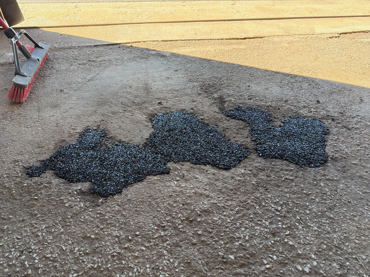 filling holes with asphalt - 1.jpeg