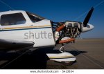 stock-photo-a-piper-general-aviation-aircraft-with-cowling-removed-for-engine-servicing-5413654.jpg