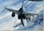 sized_1025448_A_Swedish_JAS-39_Gripen_returns_to_the_play_areas_of_the_Arctic_Challenge_exerci...JPG